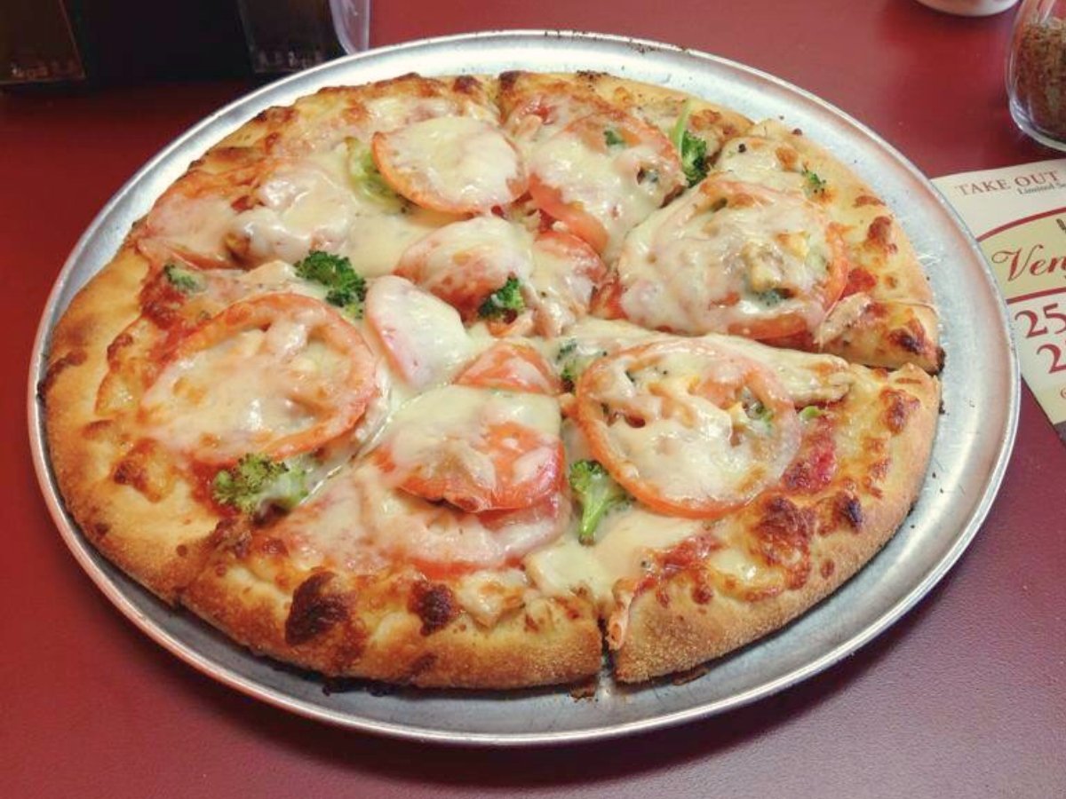 A crunchy crust pizza with delicious toppings at Venice Pizza, Huntsville, AL