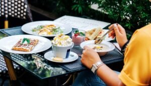 Woman Having Brunch in one of the Brunch Spots in Atlanta GA Image by Kamranaydinov