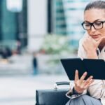 Woman reading from digital tablet Image by pixelfit from Getty Images Signature