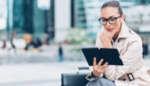 Woman reading from digital tablet Image by pixelfit from Getty Images Signature